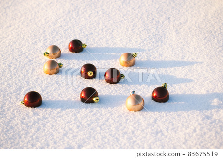 Christmas decorations on white snow Christmas decorations on white snow 83675519