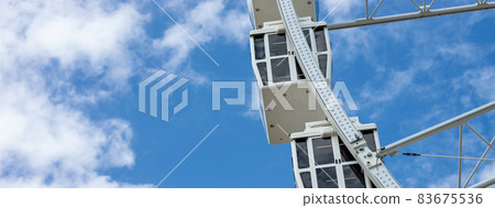 close up ferris wheel cabins with blue sky background close up ferris wheel cabins with blue sky background 83675536