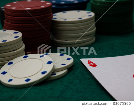 poker game table, single ace card score with stack of playing chips 83675560