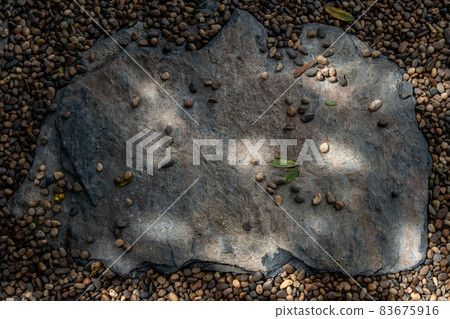 The background of the stone walkway, That has Sun rays shining through. Beautiful background, the concept of nature, Abstract background texture. The background of the stone walkway, That has Sun rays shining through. Beautiful background, the concept of nature, Abstract background texture. 83675916