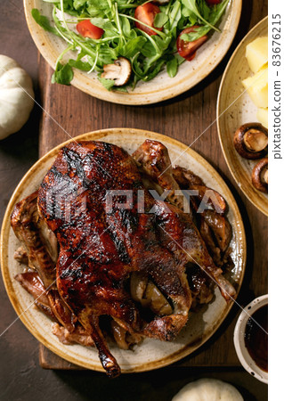 Classic dish roasted glazed duck with apples and garnish Classic dish roasted glazed duck with apples and garnish 83676215