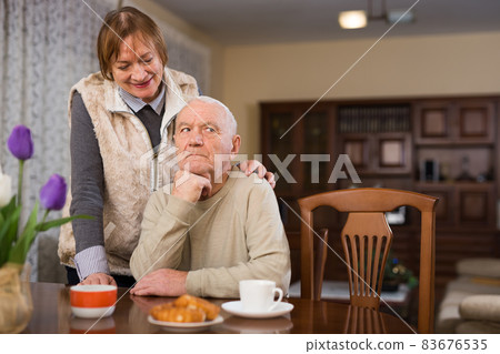 Woman asking for forgiveness from offended husband 83676535