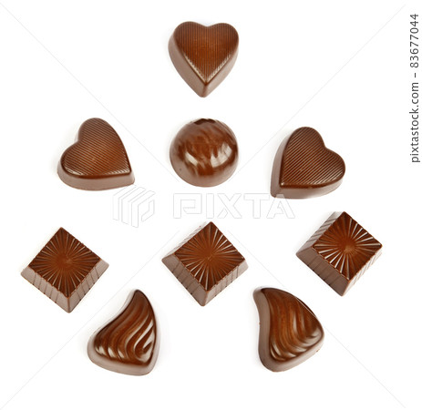 Various chocolate pralines isolated on white . Top view. Various chocolate pralines isolated on white . Top view. 83677044