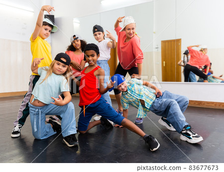 Kids hip hop dancers posing in studio Kids hip hop dancers posing in studio 83677673
