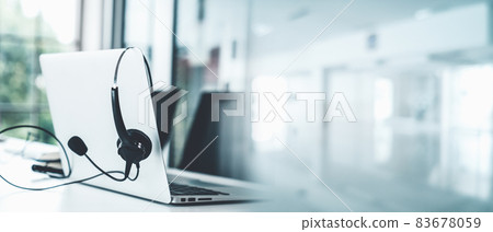 Headset and customer support equipment at call center ready for actively service 83678059