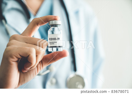 Skillful doctor prepare vaccine proficiently before injection Skillful doctor prepare vaccine proficiently before injection 83678071