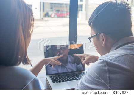 Business people discuss about problems on laptop Business people discuss about problems on laptop 83678283