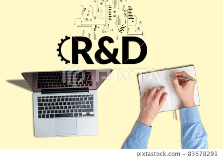 Business acronym RD or Research and Development. Person works and takes notes 83678291