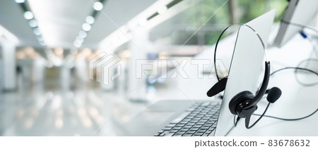 Headset and customer support equipment at call center ready for actively service Headset and customer support equipment at call center ready for actively service 83678632