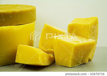 large pieces of natural beeswax, close-up, raw materials for candles. large pieces of natural beeswax, close-up, raw materials for candles. 83678738