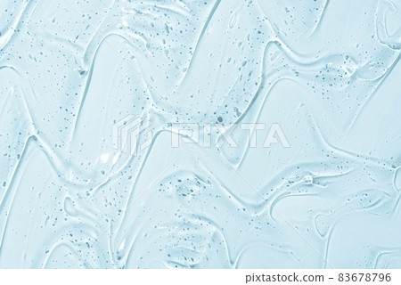Cosmetic gel or beauty jelly serum texture background. Transparent skin care collagen product backdrop. Antibacterial sanitizer or liquid water moisture toner smudged smear close up photo 83678796