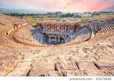 Amphitheater in ancient city of Hierapolis under dramatic pink sky 83678886