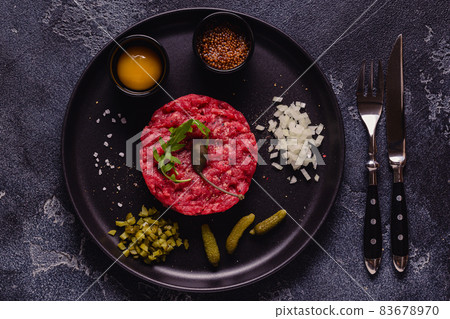 fresh beef tartar with tasty vegetables fresh beef tartar with tasty vegetables 83678970