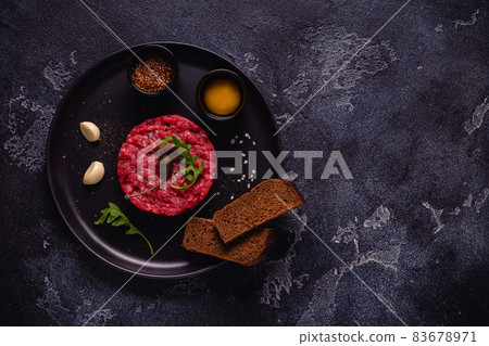 fresh beef tartar with tasty vegetables fresh beef tartar with tasty vegetables 83678971