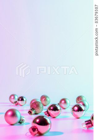 Christmas balls pattern neon background. Xmas bauble on abstract holiday winter gradient backdrop. Happy new year copy space. Christmas balls pattern neon background. Xmas bauble on abstract holiday winter gradient backdrop. Happy new year copy space. 83679387