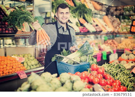Male seller helping to choose Male seller helping to choose 83679531