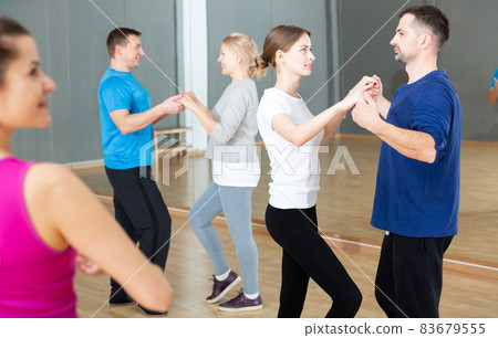 People dancing social dances in pair People dancing social dances in pair 83679555