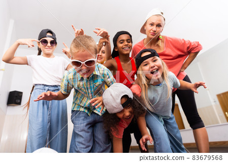 Kids hip hop dancers posing in studio Kids hip hop dancers posing in studio 83679568