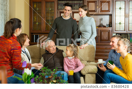 Happy family gathered in parental home Happy family gathered in parental home 83680428