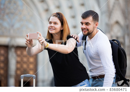 positive tourists taking selfie positive tourists taking selfie 83680471