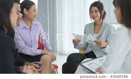 Business people proficiently discuss work project while sitting in circle Business people proficiently discuss work project while sitting in circle 83680596