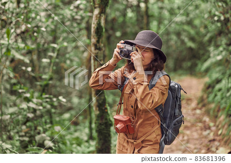 Beautiful young female caucasian tourist in equatorial africa jungles 83681396