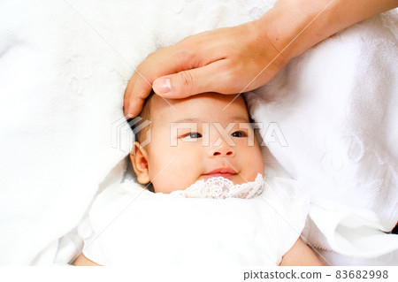 Baby stroked by dad Baby stroked by dad 83682998
