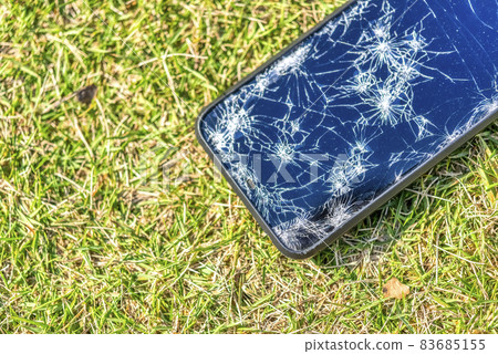 A smartphone with a broken screen when dropped 83685155