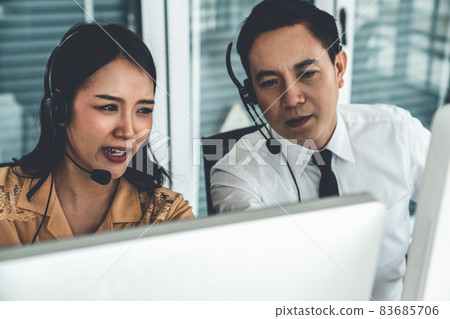 Business people wearing headset working actively in office 83685706