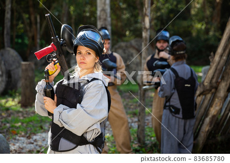 Portrait of young woman paintball player 83685780