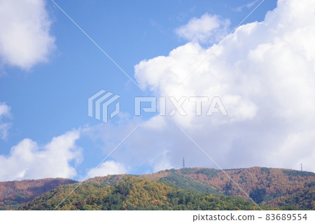 Autumnal mountains and blue sky Japanese landscape with steel towers Autumnal mountains and blue sky Japanese landscape with steel towers 83689554
