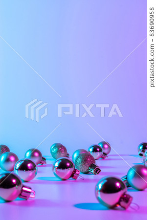 Christmas ornaments pattern neon background. Xmas bauble balls on abstract winter holiday gradient backdrop. Minimal new year card. Christmas ornaments pattern neon background. Xmas bauble balls on abstract winter holiday gradient backdrop. Minimal new year card. 83690958