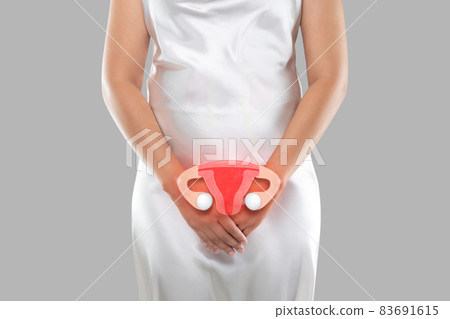 Illustration of the uterus is on the woman's body 83691615