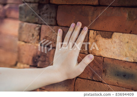 Boy tourist in Temple ruin of the My Son complex, Vietnam. Vietnam opens to tourists again after quarantine Coronovirus COVID 19 Boy tourist in Temple ruin of the My Son complex, Vietnam. Vietnam opens to tourists again after quarantine Coronovirus COVID 19 83694409
