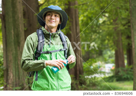 Young man enjoying a hike 83694606