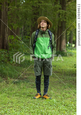 Young man enjoying a hike Young man enjoying a hike 83694611