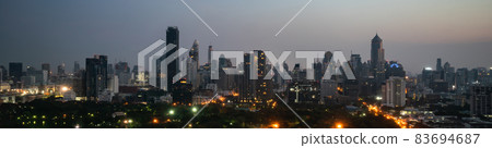 Night cityscape and high-rise buildings in metropolis city center Night cityscape and high-rise buildings in metropolis city center 83694687