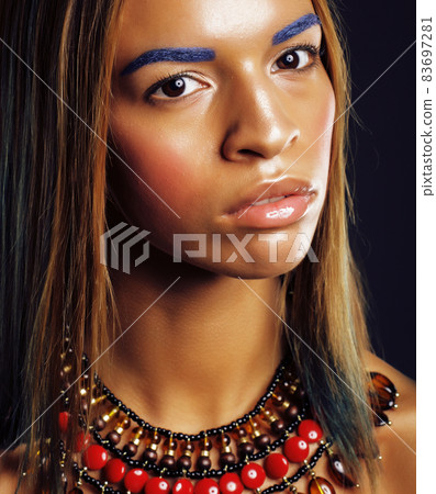 young african american woman with creative make up like ethiopian jewelry closeup dark young african american woman with creative make up like ethiopian jewelry closeup dark 83697281