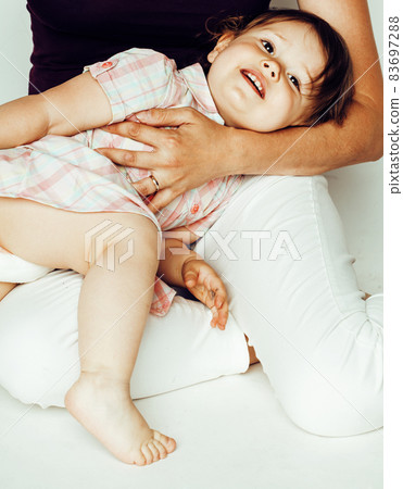 young pretty stylish mother with little cute blond daughter hugging, happy smiling real family, lifestyle people concept 83697288