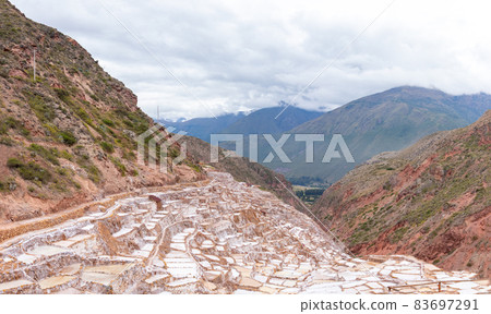 View of the natural salt pools in Las Salineras de Maras in the Sacred Valley of Cusco View of the natural salt pools in Las Salineras de Maras in the Sacred Valley of Cusco 83697291