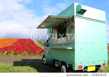 Mobile sales car in the flower field 83697670