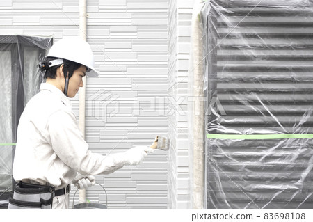 Men painting the exterior walls 83698108