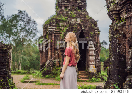 Woman tourist in Temple ruin of the My Son complex, Vietnam. Vietnam opens to tourists again after quarantine Coronovirus COVID 19 Woman tourist in Temple ruin of the My Son complex, Vietnam. Vietnam opens to tourists again after quarantine Coronovirus COVID 19 83698156