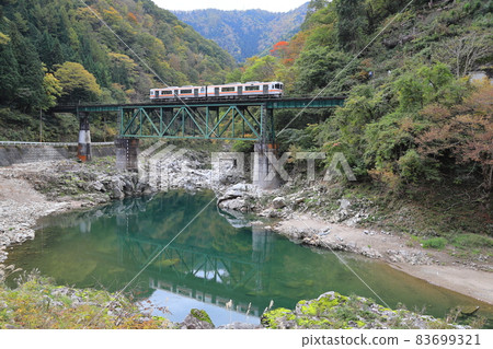 Takayama Main Line regular train running in the valley Takayama Main Line regular train running in the valley 83699321