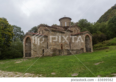 Old, abandoned temple in the Caucasus. 83699562
