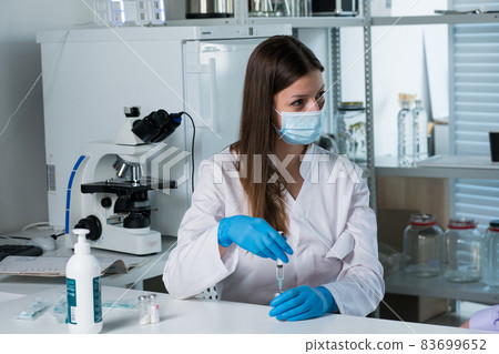 Doctor vaccinating patient in clinic. Medicine. Covid 83699652