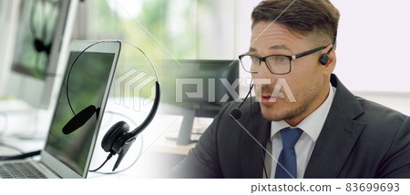 Business people wearing headset working in office broaden view Business people wearing headset working in office broaden view 83699693