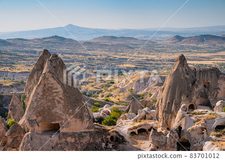 Cappadocia valley with cave houses in the foreground 83701012