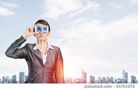 Woman covering her eyes with smartphone Woman covering her eyes with smartphone 83701078
