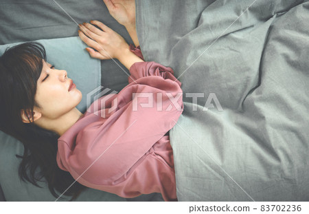 A woman in the bedroom 83702236